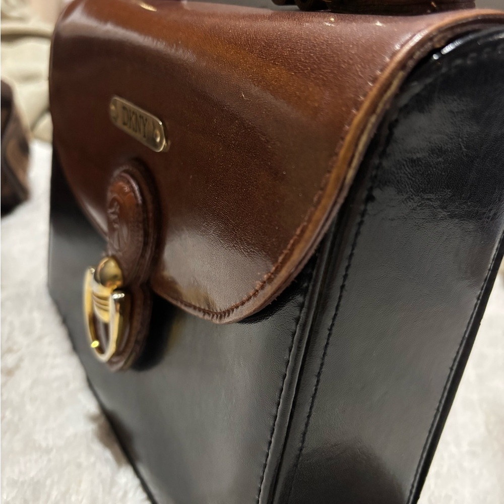 DKNY Black and Brown Leather Briefcase with Gold Accents